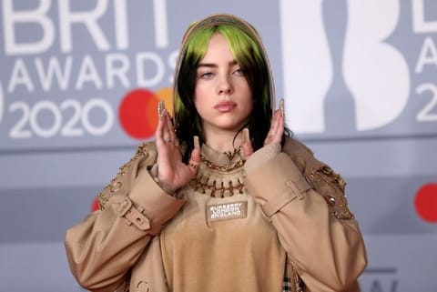 Billie Eilish poses as she arrives for Brit Awards at O2 Arena in London (Image credit: Reuters)