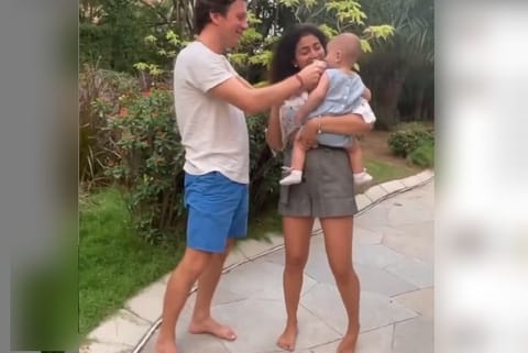 Screengrab of Shriya Saran and her husband with their baby.