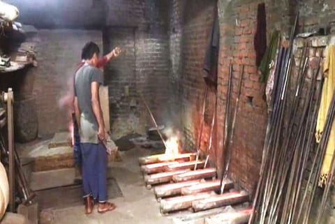 Artisans working in a Moradabad unit