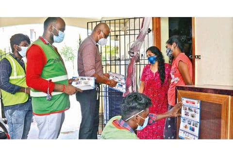 Officials of GCC explaining to remove stagnant water during a door-to-door dengue awareness campaign