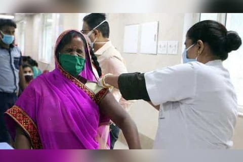 A health worker injecting a covid jab to a person (Image credit: PTI)