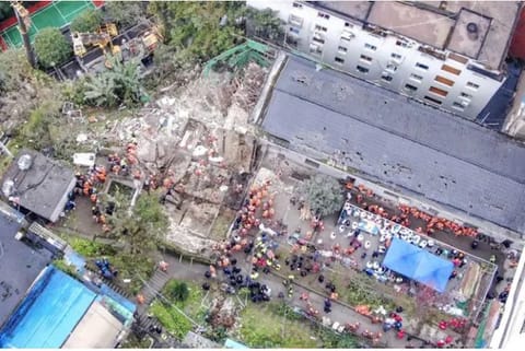 Emergency officials work at the site of an explosion in southwestern China (Source: AP)