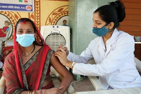 A citizen getting her vaccination dose (Source: ANI)