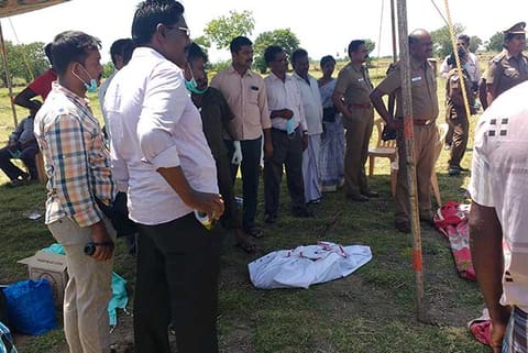 Officials supervising exhumation of bodies of persons killed by T Sappani, in Tiruchy