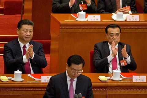 Chinese President Xi Jinping, left and Premier Li Keqiang at closing session of National Congress