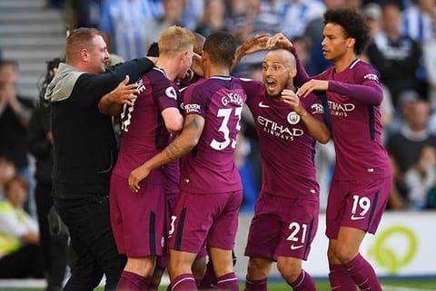 Manchester City players celebrate their win