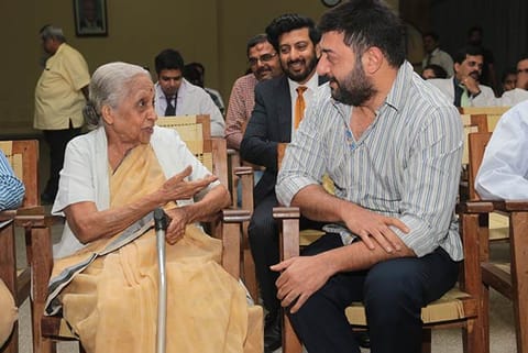 Chairperson of Adyar Cancer Institute Dr V Shanta speaks with actor Arvind Swamy during an event