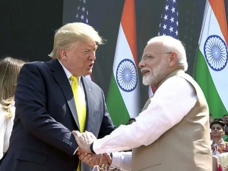 Narendra Modi shakes hand with Donald Trump during the 'Namaste Trump' event at Motera Stadium in Ahmedabad. 