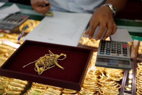 Many Asians hold gold as savings and investments. In Bangkok, gold shops are clustered in Chinatown, where long lines stretched even further by social distancing.