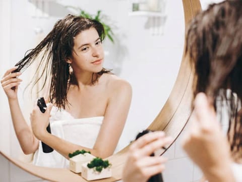 Just like your skin, your hair gets thirsty. Use a hydrating shampoo and conditioner, look for ingredients like argan oil, coconut oil, or aloe vera.