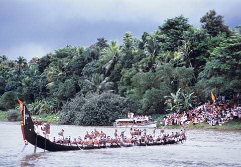 A snake boat on a river in Kerala. Apart from new initiatives, Kerala is attracting tourists with its wellness and medical tourism, natural beauty, lush greenery, backwaters, and rich cultural heritage.
