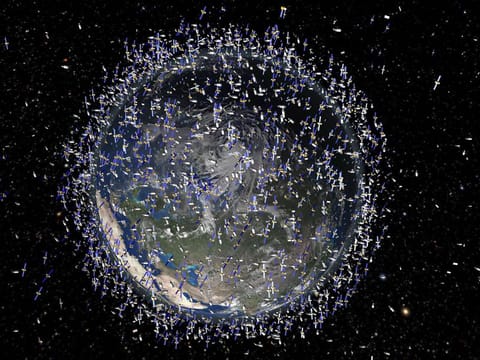 THOUSANDS HOVERING IN THE SKIES ABOVE US: At any given moment, thousands of satellites hover above us. 