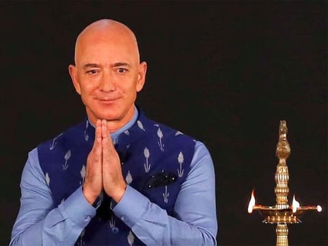 Jeff Bezos | Net Worth: $262 billion. Bezos is the founder of Amazon, the world's biggest online retailer. The Seattle-based company sells electronics, household goods and other products through its flagship website. It also controls the Whole Foods grocery chain and offers cloud computing (via (AWS) and streaming services. He stepped down as CEO to become executive chairman in July 2021, but still owns 8.6% of Amazon's stocks.
