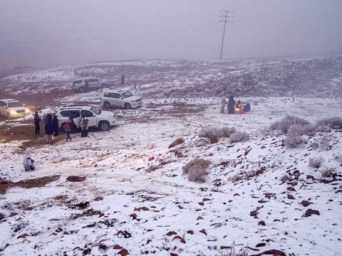 Saudis play in the snow in Jabal Al Lawz (Mountain of Almonds), west of the Saudi city of Tabuk. Tourists thronged to the peak of Jabal Al Lawz, which is completely covered in white. 