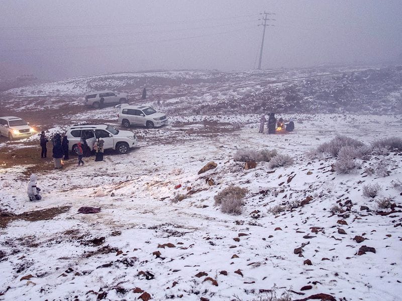 Saudis play in the snow in Jabal Al Lawz (Mountain of Almonds), west of the Saudi city of Tabuk. Tourists thronged to the peak of Jabal Al Lawz, which is completely covered in white. 