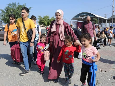 Seventy-six wounded Palestinians and 335 foreigners or dual-nationals were allowed to cross from the war-torn Gaza Strip for Egypt on Wednesday, an Egyptian official at the Rafah crossing said.
