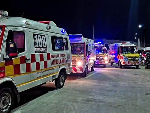 The woman had fainted during the race and was being taken to the hospital in an ambulance stationed at the event site.