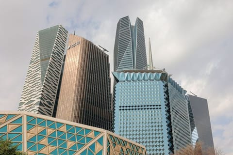 The KAFD World Trade Center, Riyadh Bank skyscraper office building, Public Investment Fund (PIF) tower, and the Saudi National Bank (SNB) headquarters, left to right, beyond the King Abdullah Financial District Conference Center in the King Abdullah Financial District (KAFD) in Riyadh, Saudi Arabia.