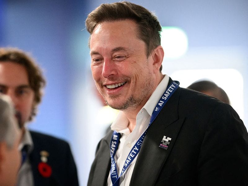 Tesla, X (formerly known as Twitter) and SpaceX's CEO Elon Musk speaks with other delegates on Day 1 of the AI Safety Summit at Bletchley Park in Bletchley, Britain on November 1, 2023. The UK Government are hosting the AI Safety Summit bringing together international governments, leading AI companies, civil society groups and experts in research to consider the risks of AI, especially at the frontier of development, and discuss how they can be mitigated through internationally coordinated action.     Leon Neal/Pool via REUTERS
