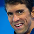 (FILES) A file photo taken on August 24, 2017 shows Michael Phelps of the US reacting during the medal ceremony following the men's 100m butterfly final at the Gold Coast Aquatic Centre in Gold Coast. Michael Phelps, the most decorated Olympian of all time, was on June 5, 2017, appointed to the board of an Australian company that deals with mental health issues, a subject close to his heart.  The American, who won 28 Olympic medals, is working to establish himself in business after quitting swimming last year and said joining Medibio met his aim to raise awareness of depression and similar problems.
 - MAGE RESTRICTED TO EDITORIAL USE - NO COMMERCIAL USE
 / AFP / PATRICK HAMILTON / MAGE RESTRICTED TO EDITORIAL USE - NO COMMERCIAL USE