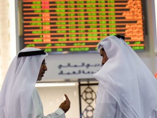 Traders at the Dubai Financial Market (DFM). 