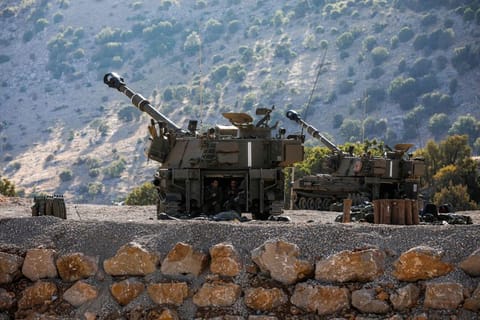 An Israeli tank points to Syria at the Occupied Golan Heights. 