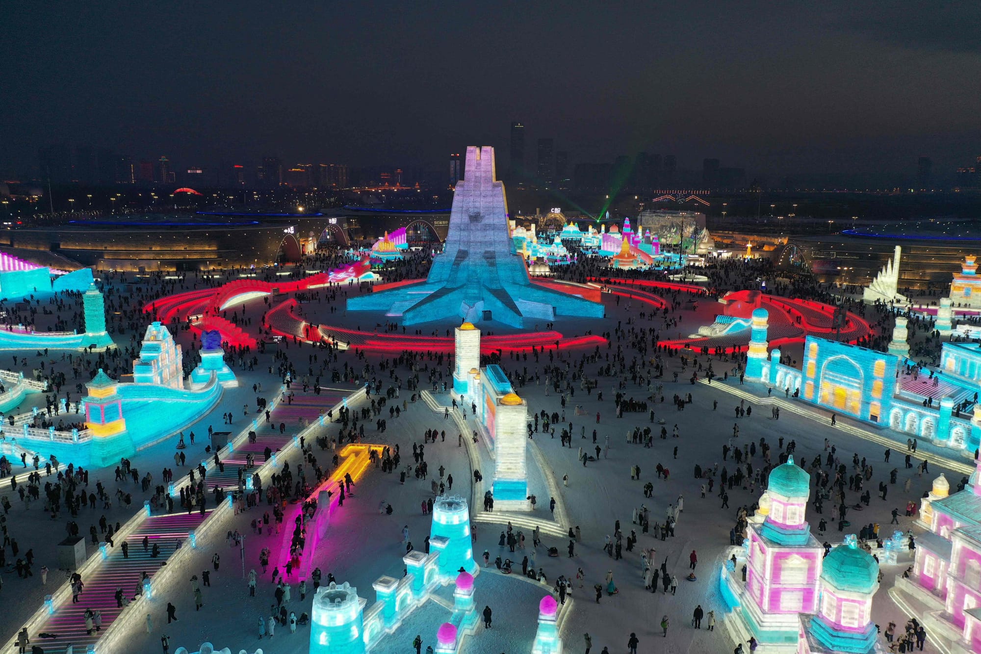 This photo taken on December 21, 2024 shows people visiting the Harbin Ice and Snow World Festival in Harbin, also known as the ‘City of Ice’, northeast China's Heilongjiang province. 