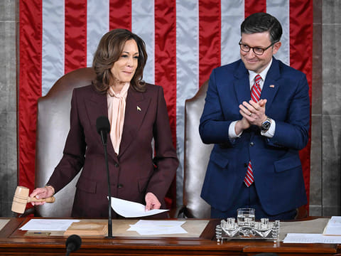US Vice President Kamala Harris hits the gavel after reading the vote totals as Speaker of the House Mike Johnson looks on during of a joint session of Congress to certify the results of the 2024 Presidential election, inside the House Chamber at the US Capitol on January 6, 2025, in Washington, DC.   