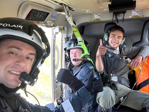 Police officers reacting after they rescued 23-year-old university student Hadi Nazari (R), who was lost in Australia's alpine wilderness and survived for almost two weeks on foraged berries and scavenged muesli bars, police said.  