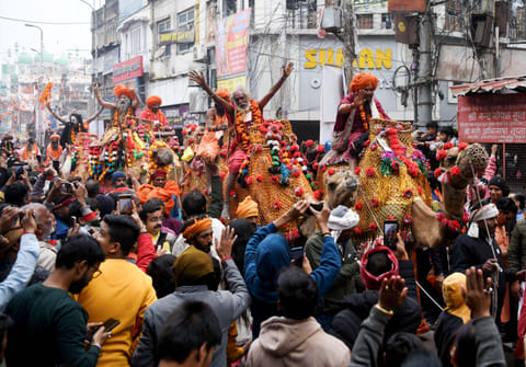 Seers or holy men of 'Shri Panchayati Akhara Bada Udasin' and others take part in a 'Chhavani Pravesh' procession on the eve of Maha Kumbh 2025, at Sangam in Prayagraj on Sunday. 