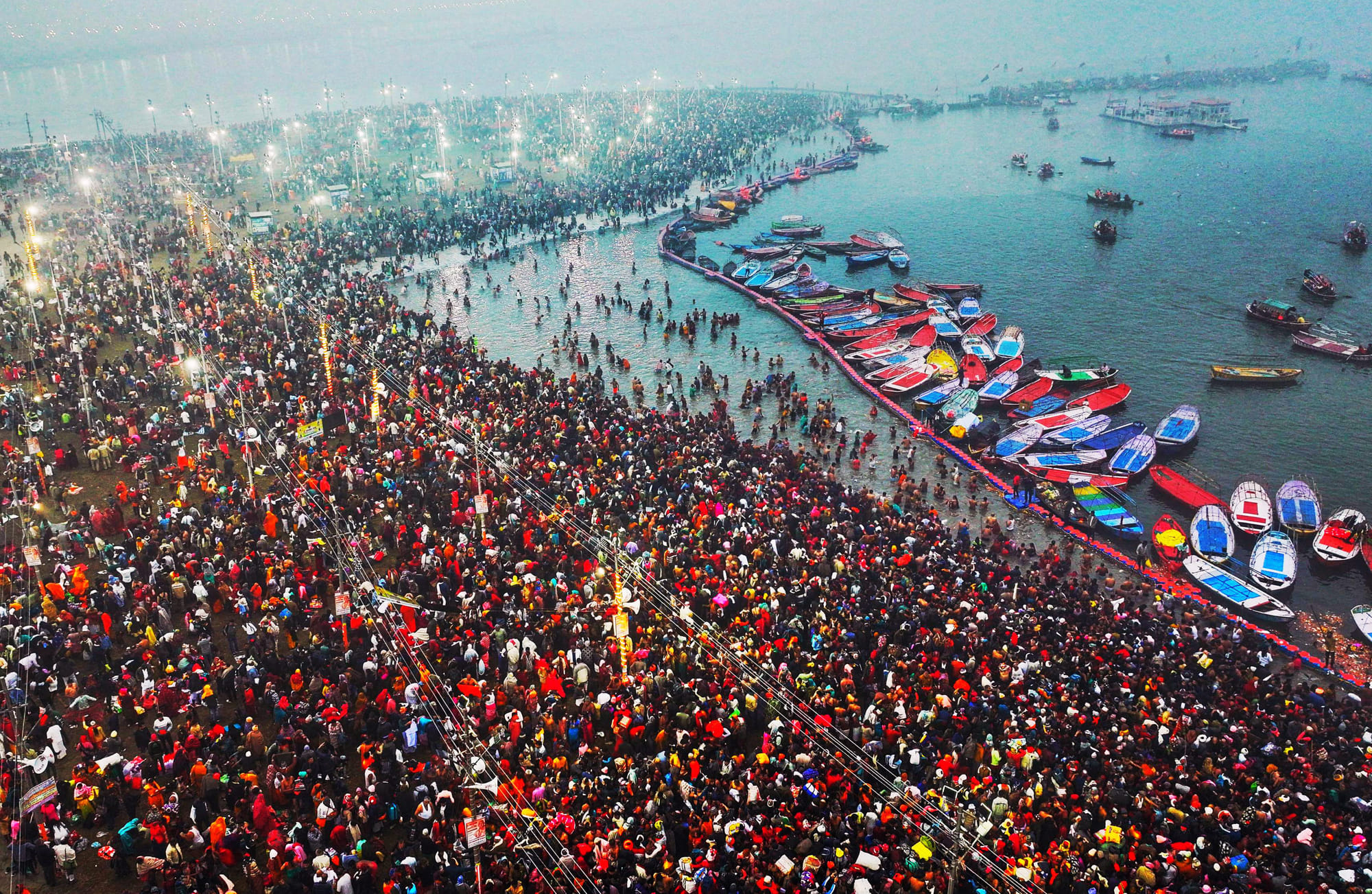 Vast crowds of Hindu pilgrims bathed in the sacred waters of the Sangam, the confluence of the Ganges, Yamuna, and the mythical Saraswati rivers, as the Kumbh Mela festival kicked off in Prayagraj on January 13. Organizers expect over 400 million people to gather for the world's largest religious festival over the next six weeks. The event draws millions of devotees seeking spiritual purification during the grand religious gathering.