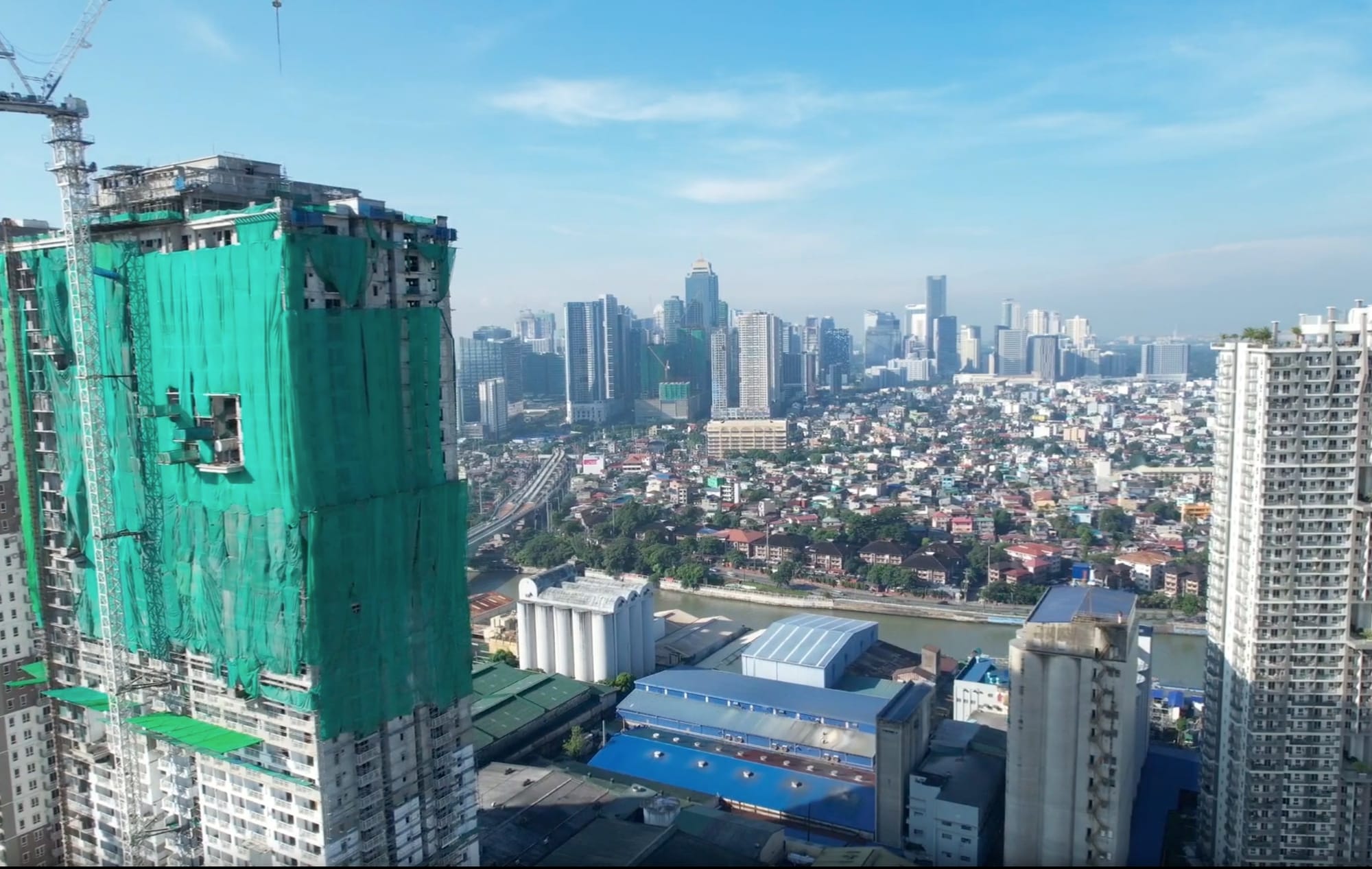 Towering high-rises above Manila’s skyline. Beyond the bustling Pasig River banks are the glimmering spires of Bonifacio Global City (BGC) and Makati, as well as low-rise residential areas, with an untold number of "informal settlers".






