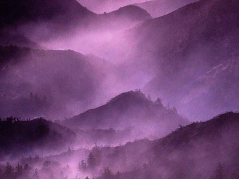 Smoke from the Eaton Fire lingers above the mountains of the Angeles National Forest north of Altadina, California.