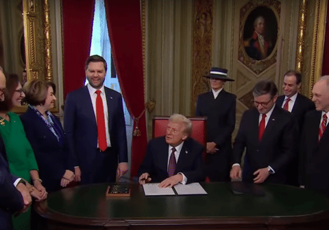 US President Donald Trump signs executive orders on his first day in the Oval Office on January 20, 2025.
