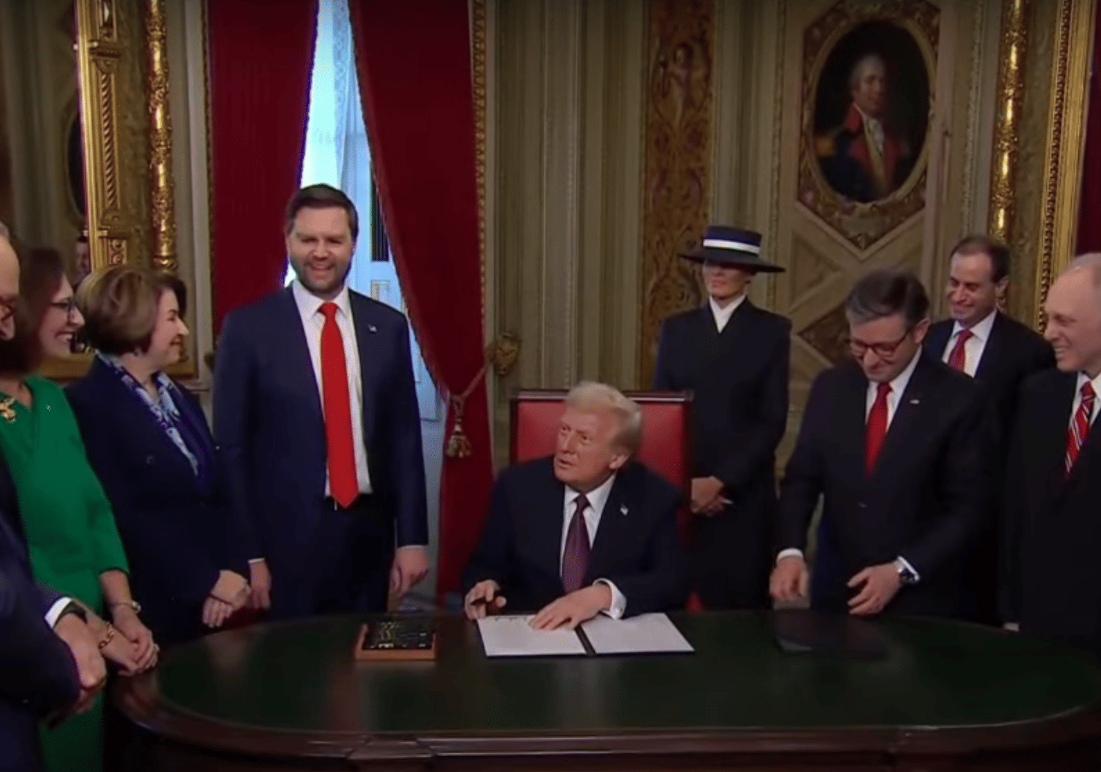 US President Donald Trump signs executive orders on his first day in the Oval Office on January 20, 2025.
