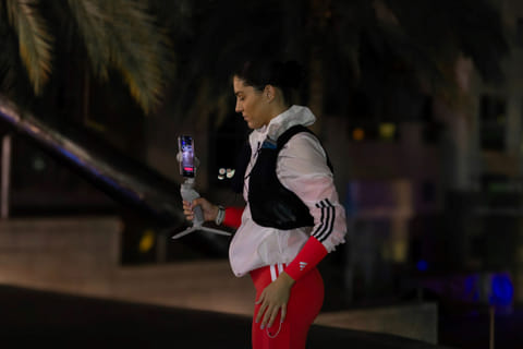 Lily Collyer sets out on the solo night marathon using a gimbal to livestream the 42km run in Dubai on January 16