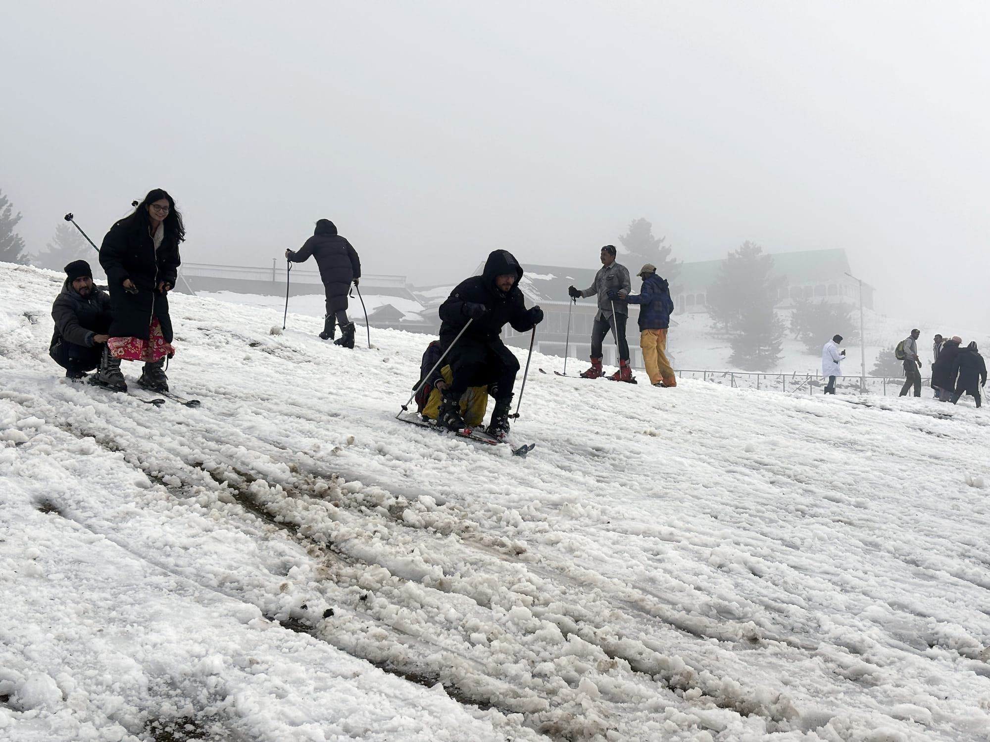 Tourists enjoy skiing on the snow-covered area after the upper reaches of Jammu & Kashmir receive fresh snowfall, at Gulmarg. Around 3.5 million tourists visited Kashmir in 2024, according to official figures, the majority domestic visitors.