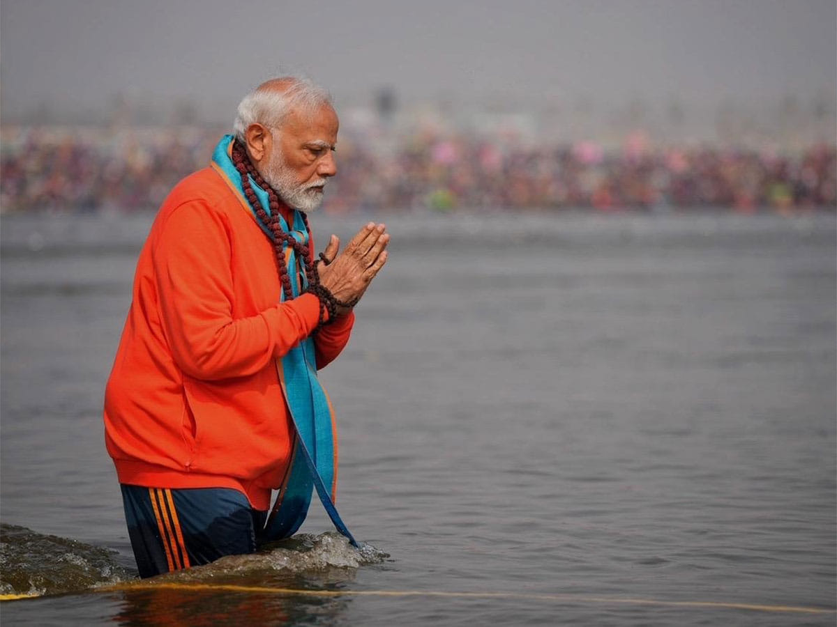 India's Prime Minister Narendra Modi takes a holy dip at the Samgam as part of his visit to the Maha Kumbh.