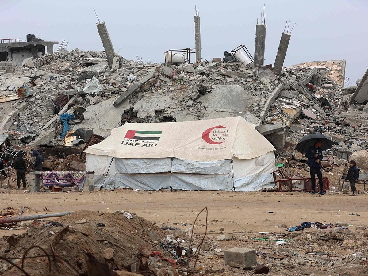 A UAE AID tent stands in front of a collapsed building at Saftawi street in Jabalia in the northern Gaza Strip on February 5, 2025, during a ceasefire deal in the war between Israel and Hamas. 