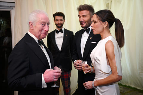 Britain's King Charles III reacts as he meets British fashion designer Victoria Beckham and British Ex-Footballer David Beckham, February 7, 2025.