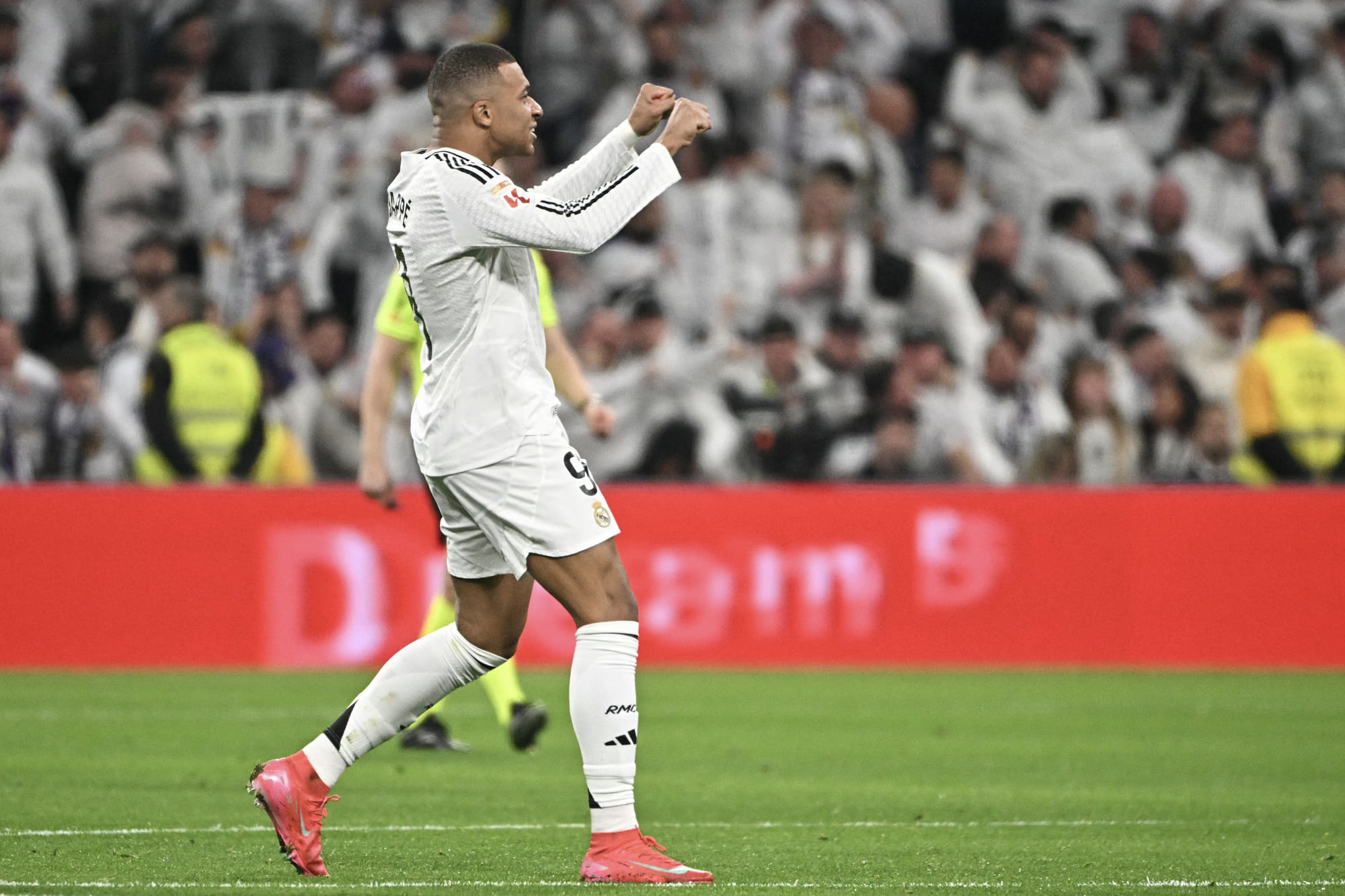 Real Madrid's French forward #09 Kylian Mbappe celebrates scoring their first goal during the Spanish league football match between Real Madrid CF and Club Atletico de Madrid at Santiago Bernabeu Stadium in Madrid on February 8.