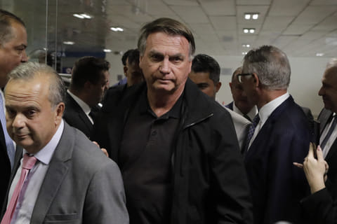 Former Brazil's President Jair Bolsonaro (C) arrives at the Federal Senate to have lunch with leaders of opposition parties in Brasilia on February 18, 2025.
