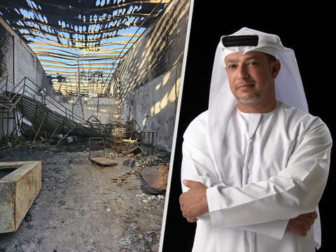 Jalal Luqman, right, and what the fire left of his works in the warehouse that served as his studio in Abu Dhabi.