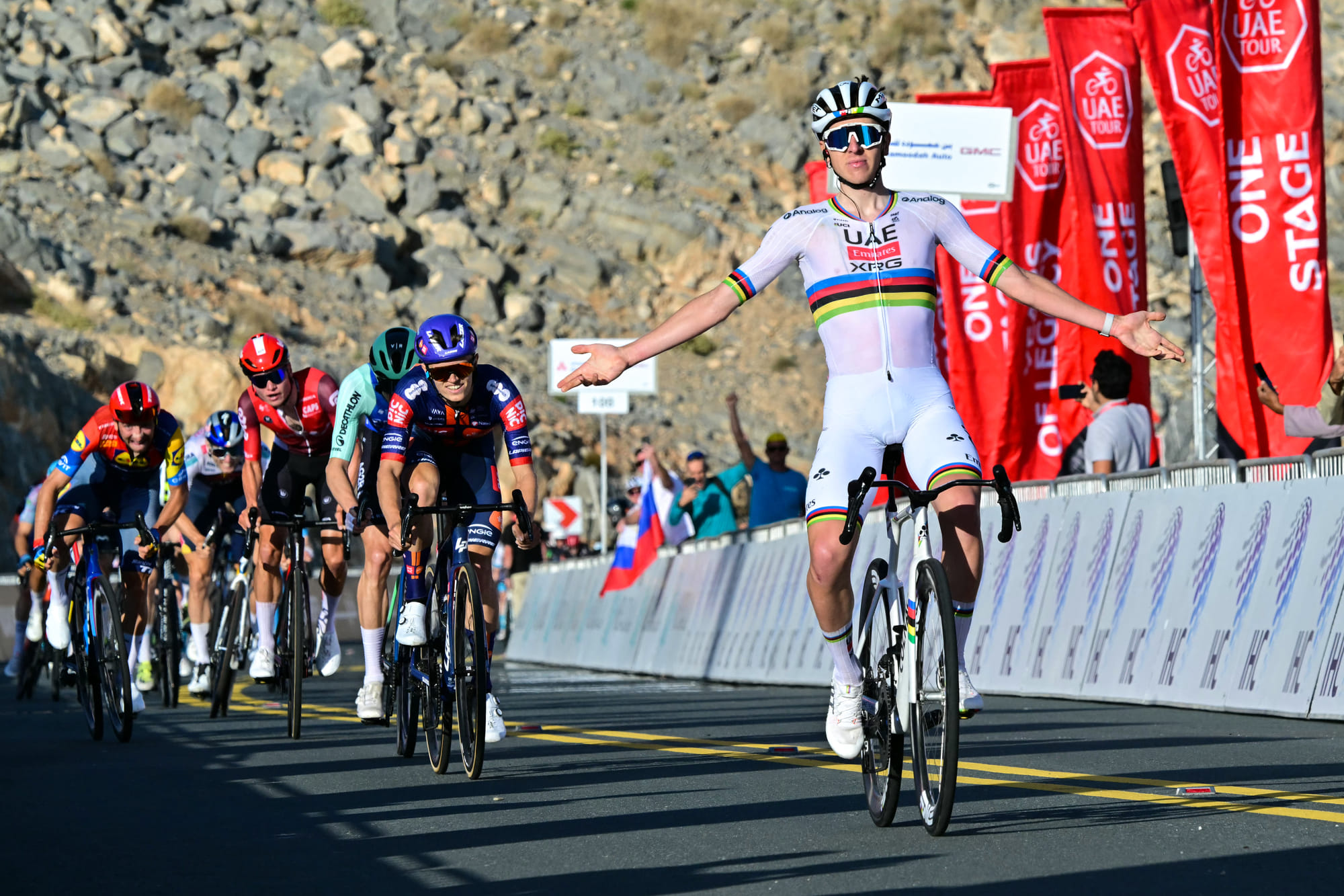 UAE Team Emirates' Slovenian rider Tadej Pogacar celebrates as he crosses the finish line at the end of the seventh stage of the UAE Tour cycling race from Hazza Bin Zayed Stadium to Jebel Hafeet in the UAE on February 23.