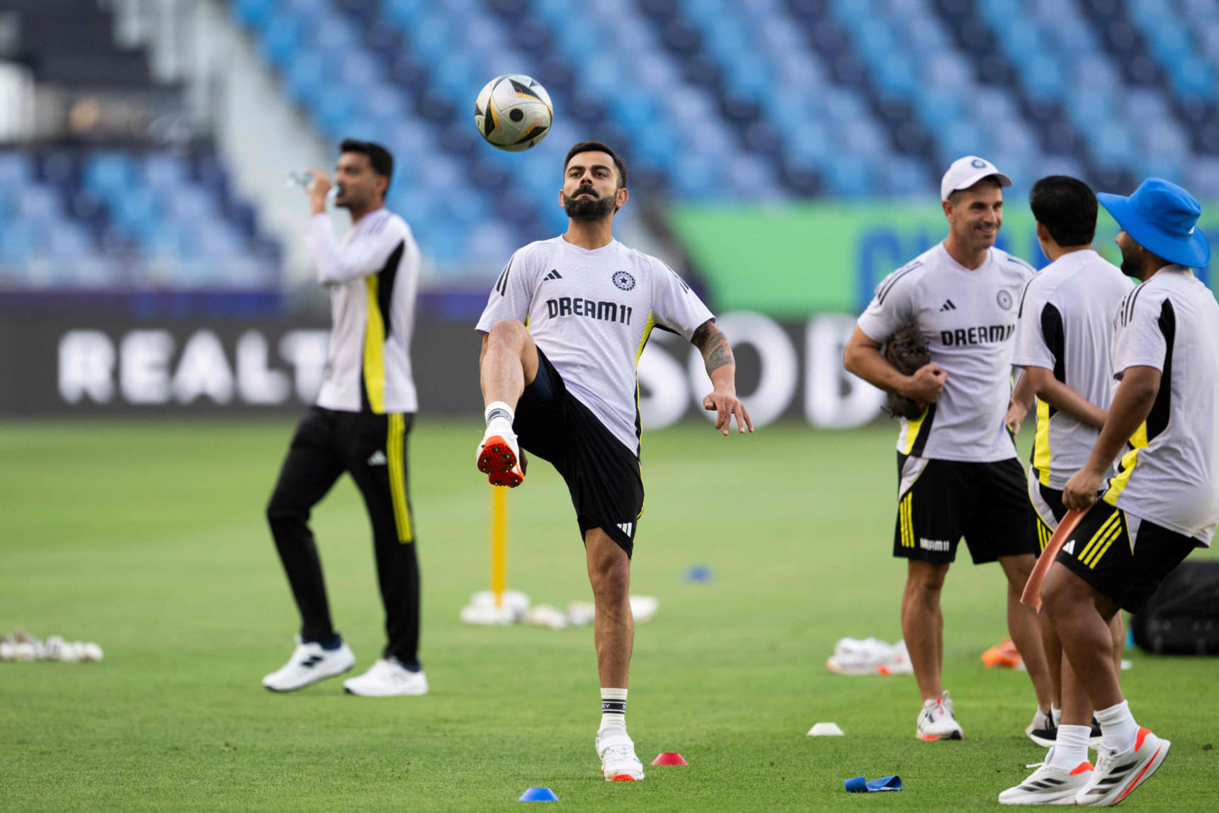 India's Virat Kohli controls a football during a practice session at the Dubai International Stadium in Dubai on February 19.