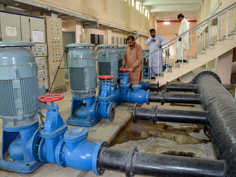 Technical staff work at the USAID-funded Pakistani non-profit HANDS water supply plant in Jacobabad in southern Sindh province on February 18, 2025.  