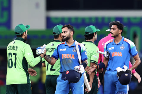 India's Virat Kohli and Axar Patel shake hands with Pakistan's players after winning the Champions Trophy match in Dubai on February 23. The two teams will be facing each other on September 14 with another two potential contests during Asia Cup.
