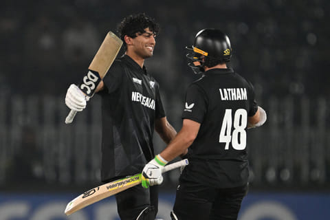 New Zealand’s Rachin Ravindra (left) celebrates after scoring a century with teammate Tom Latham during the ICC Champions Trophy One-Day International (ODI) cricket match against Bangladesh at the Rawalpindi Cricket Stadium in Rawalpindi on February 24.