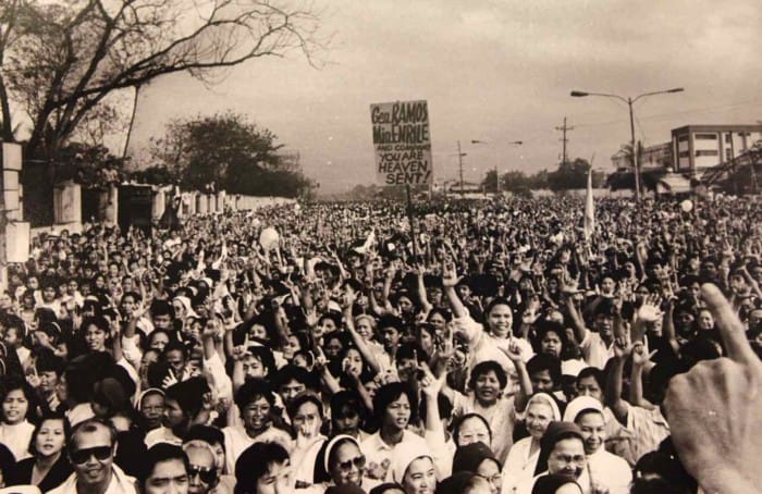 PEACE OVER VIOLENCE: A scene during the EDSA "People Power" revolution in February 1986. The event is a shining moment in the history of the world, which ushered in a peaceful revolt and the ouster of the 21-year Marcos dictatorship.  
