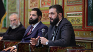 Syria's interim leader Ahmed Al Sharaa attends a meeting with officials and local leaders in the western coastal city of Tartus. 